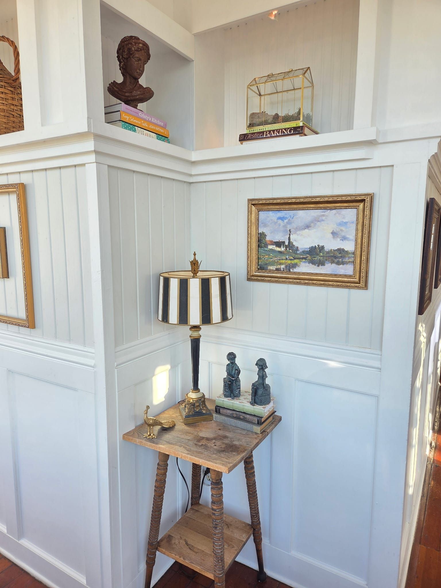 A corner with a striped lamp and small figures