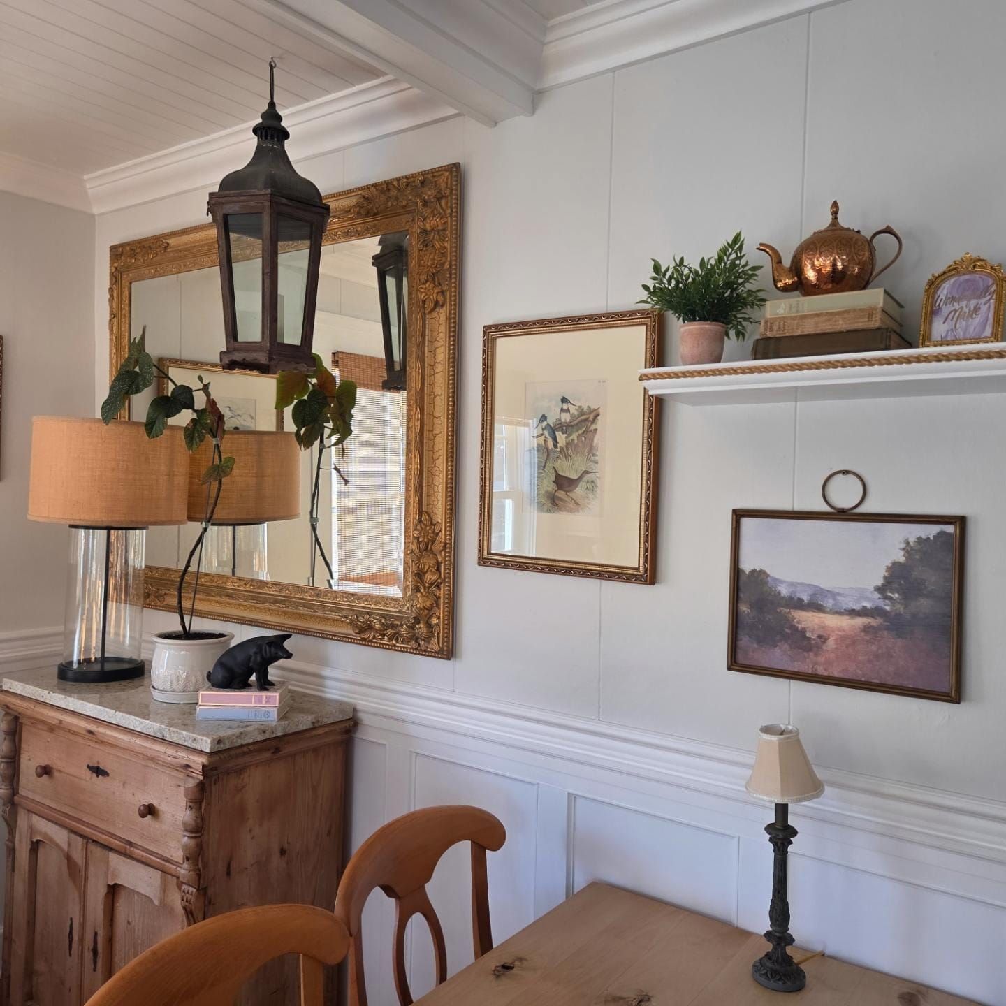 Antique sideboard with a hanging lantern mirror