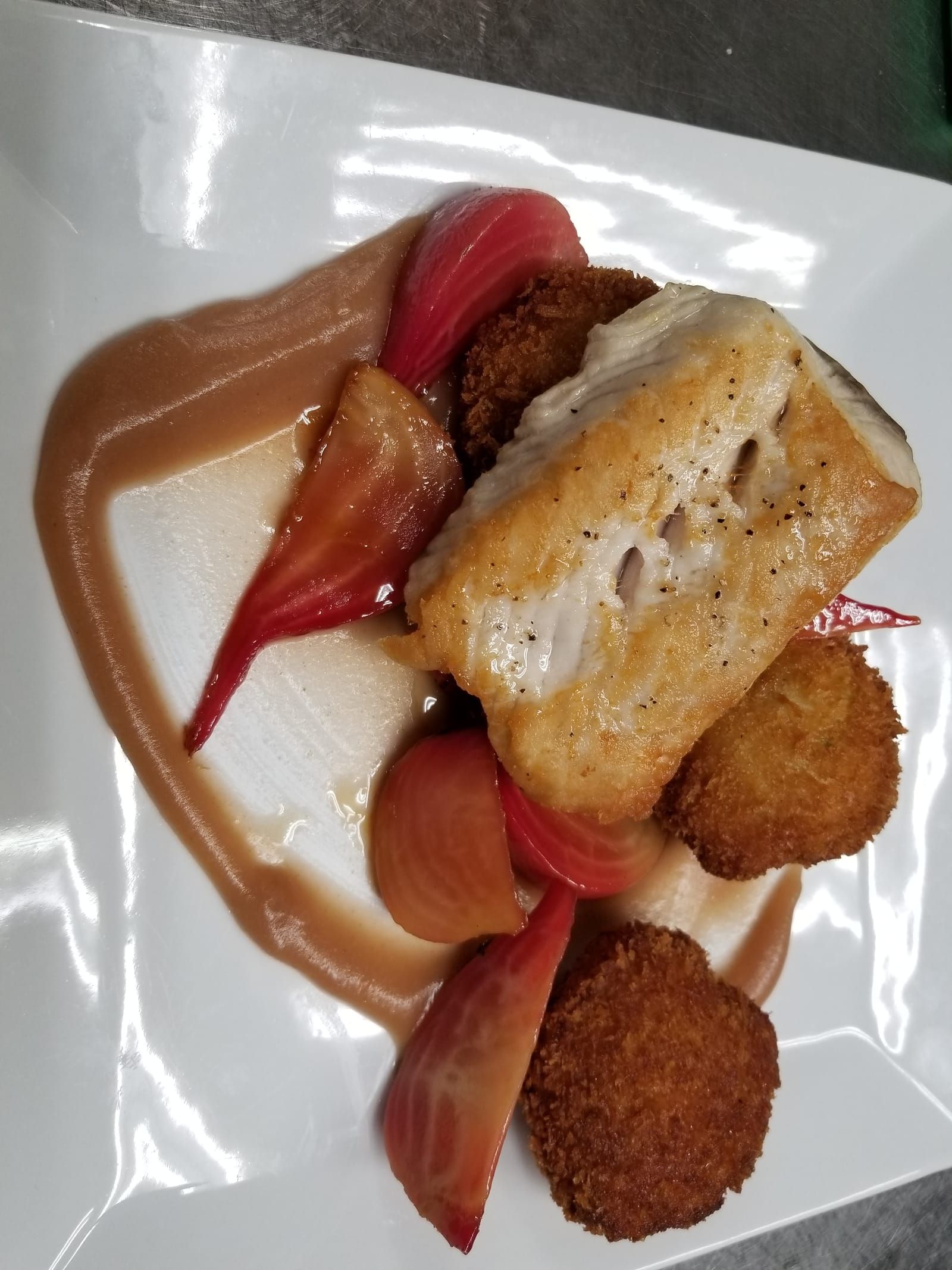 Pan-seared white fish with croquettes and beets
